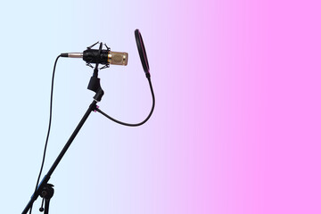 Stand with professional microphone on color background