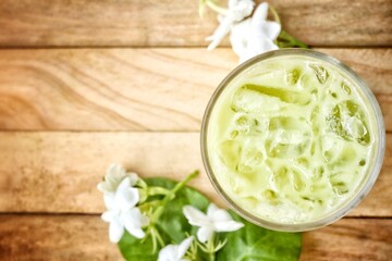 Ice matcha green tea with milk and white jasmine flowers