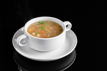 Steaming Vegetable Soup in White Bowl