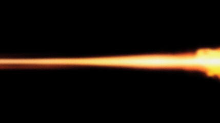 Grain noise texture Vivid light streak, golden hues, on dark background. Energy emission