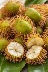 Closeup of Fresh Rambutan Fruit Pile on Leaf