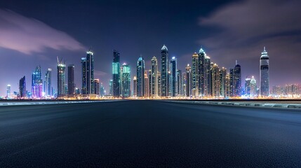 Obraz premium A panoramic skyline of modern commercial buildings glowing at night, their illuminated glass facades reflecting vibrant city lights 