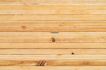 Fototapeta premium Industrial Warehouse with Stacked Wooden Planks, Pile of Rough Hardwood Timber Boards in Brown, Featuring Natural Patterns Texture, Ready for Construction and Material Storage Factory