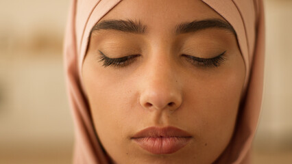 Close up face sad upset stressed Arabian woman Indian Muslim Islamic girl female lady religion in...