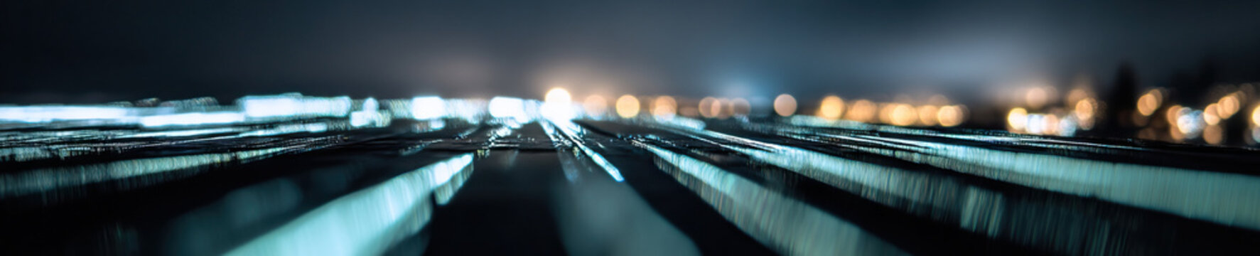 Nighttime City Lights Reflected on Textured Surface