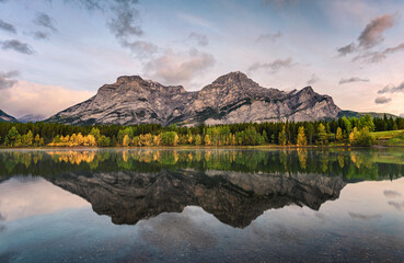 Canadian rockies reflection on Wedge pond in the morning at Kananaskis country