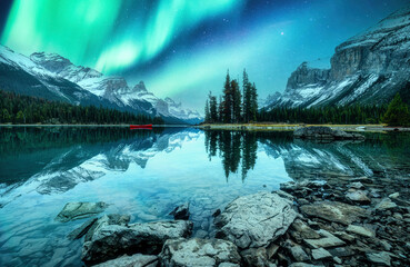 Spirit Island with aurora borealis glowing in the night sky on Maligne Lake at Jasper national park, Canada