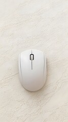 White Wireless Computer Mouse on Beige Textured Surface