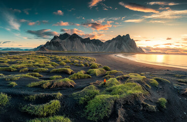 Sunrise over Vestrahorn mountain on black sand beach in Stokksnes peninsula at Iceland