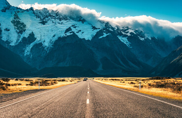 Road trip leading to Mount Cook amidst grassland in national park during autumn at New Zealand