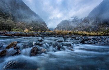 Landscape of Monkey Creek with flowing stream as a beautiful spot on the road to Milford Sound