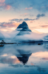 Milford Sound with Mitre peak in foggy on the lake during the morning at New Zealand