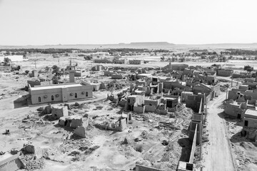 View of the small village Raghba with the abandoned mud houses in the middle of the desert in Saudi Arabia