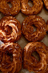 A Tray of Freshly Baked Pastries Exuding Warmth and Aroma in a Cozy Rustic Bakery