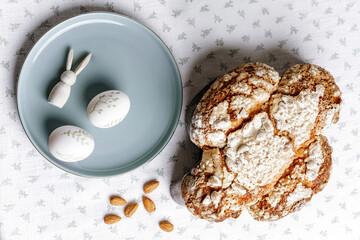 Colomba - Italian traditional Easter bread is topped with pearl sugar and almonds in the shape of a dove. Festive pastries are traditional in Italy.