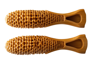 Wooden dog chew toys promoting dental health and hygiene featuring intricate honeycomb patterns against a stark black background with warm golden light.