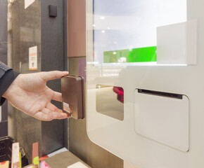 Self-checkouts or self-service checkouts,man paying for the purchases  in supermarkets