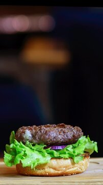 Building Perfect Juicy Burger. Ingredient Assembly Shot of a Gourmet Burger