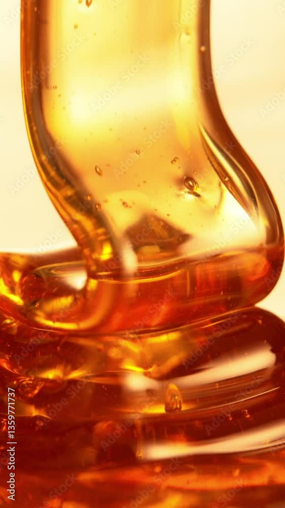 Aufkleber super slow motion of dripping honey creating wavy shape in detail. extreme macro shot, selective foc
