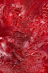 ripe red raspberries frozen in water