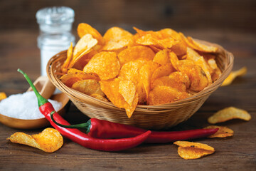 Spicy potato chips with peppers in the bowl