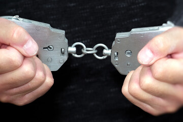 Hands Breaking Free from Handcuffs, a Powerful Symbol of Liberation, Independence, and Freedom