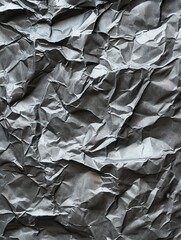 Close-up shot of crumpled paper. Ideal for backgrounds and textures in graphic design projects.