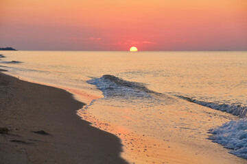 Sunrise Over Calm Ocean Waters