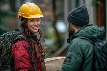Fototapeta premium Smiling Woman in Winter Delivering Items to a Friend on a Snowy Day