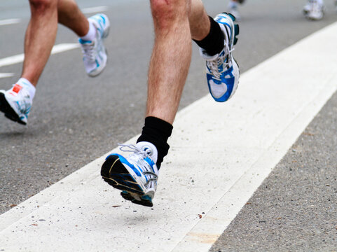 Rotterdam, The Netherlands &ndash; April 11, 2010: Athletes running past in the 30th edition of the ABN AMRO Rotterdam Marathon held in the city center..