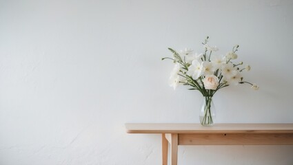 white wall interior featuring flowers on a table