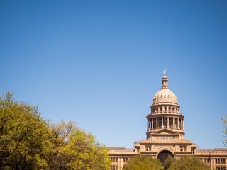 Austin Texas State Capitol Building with American flag and Texas flag © Jess Yurinko Photo