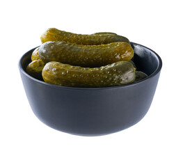 pickled cucumbers in a black bowl isolated on a white background.