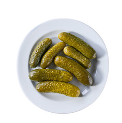 pickled cucumbers on a white plate isolated on a white background, top view.