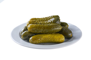 pickled cucumbers on a white plate isolated on a white background.
