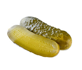 whole and halved pickled cucumber isolated on a white background.