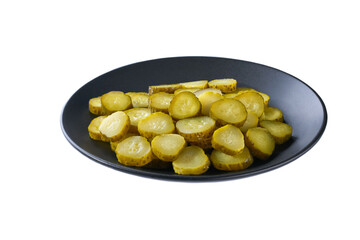 chopped pickled cucumbers in a black plate isolated on a white background.