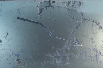 A chart of a fall drawn on a frozen car window, the concept of falling quotes, sales, etc.