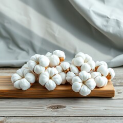 Luxurious Cotton Balls on Wood Plank with Teal Accents