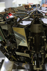 Intricate robotic design showcases reflective surfaces at technology exhibition