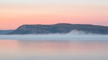 Fototapeta premium Misty lake sunrise over mountains