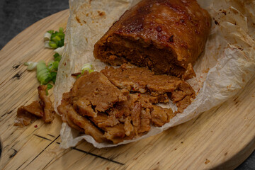 Washed flour seitan cooked with spices,  baked and sliced
