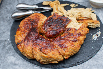 Roasted seitan as plant based meat on slate stone