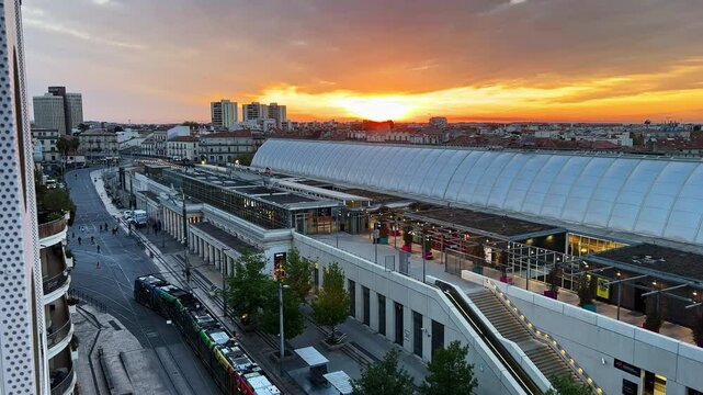 Aerial View of Modern Train Station and Tramlines at Sunset in Montpellier
