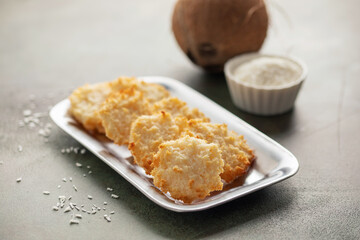 Cocada, traditional latin american coconut candy with grated coconut in plate.