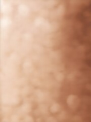 A blurred close-up of warm beige and brown textures, creating an abstract and soft aesthetic.