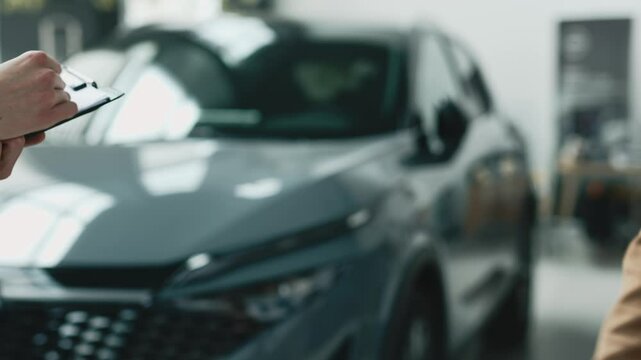 A close-up of the customer receiving the car keys from the dealer in a showroom. Concept an effortless car buying experience, highlighting professionalism and satisfaction in a luxury dealership.