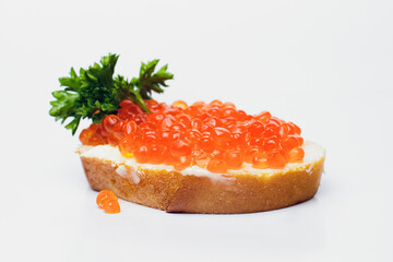 Savor delicious bread with red caviar and fresh parsley, perfect for any occasion