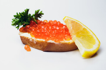 Savor delicious bread with red caviar and fresh parsley, perfect for any occasion