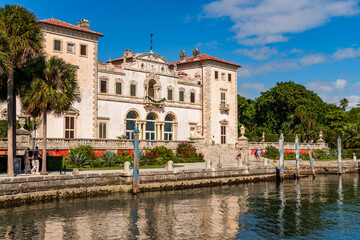 Fototapeta premium Miami, Florida - December 01, 2024: Vizcaya museum waterfront architecture. Vizcaya Museum and Gardens. Villa Vizcaya historical building museum. Sea waterfront historical landmark of Florida